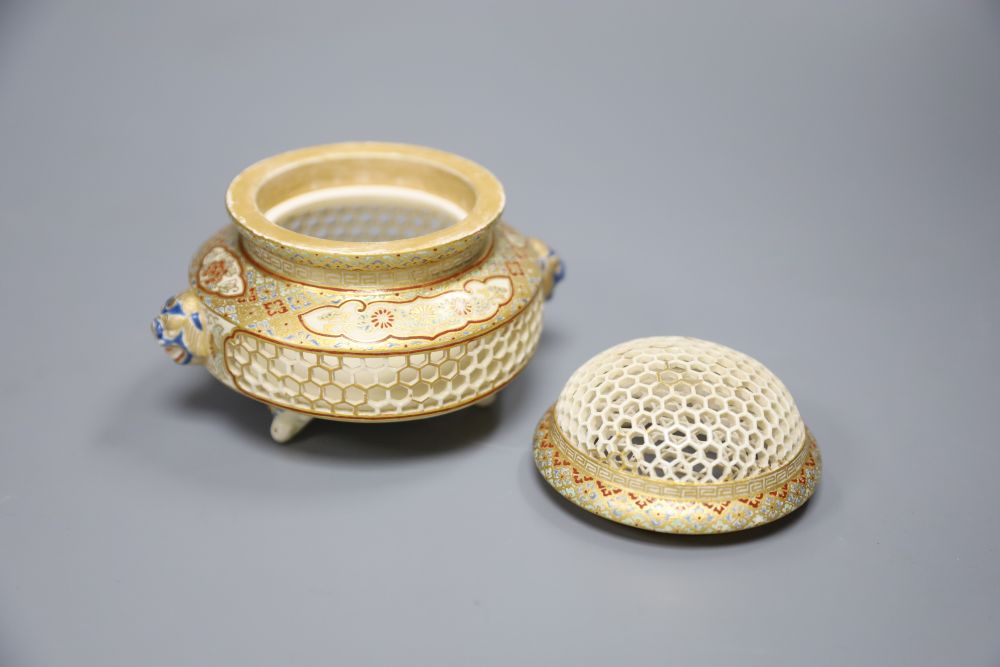 A Meiji period Satsuma reticulated pot pourri bowl and cover, 9cm and an ivory okimono (a.f.)